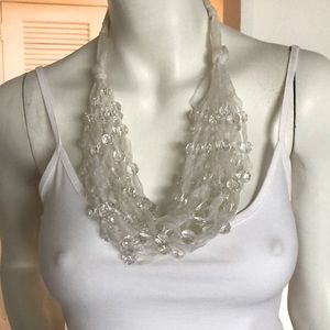 Italian unique white necklace beads on strands of shinny fabric.
